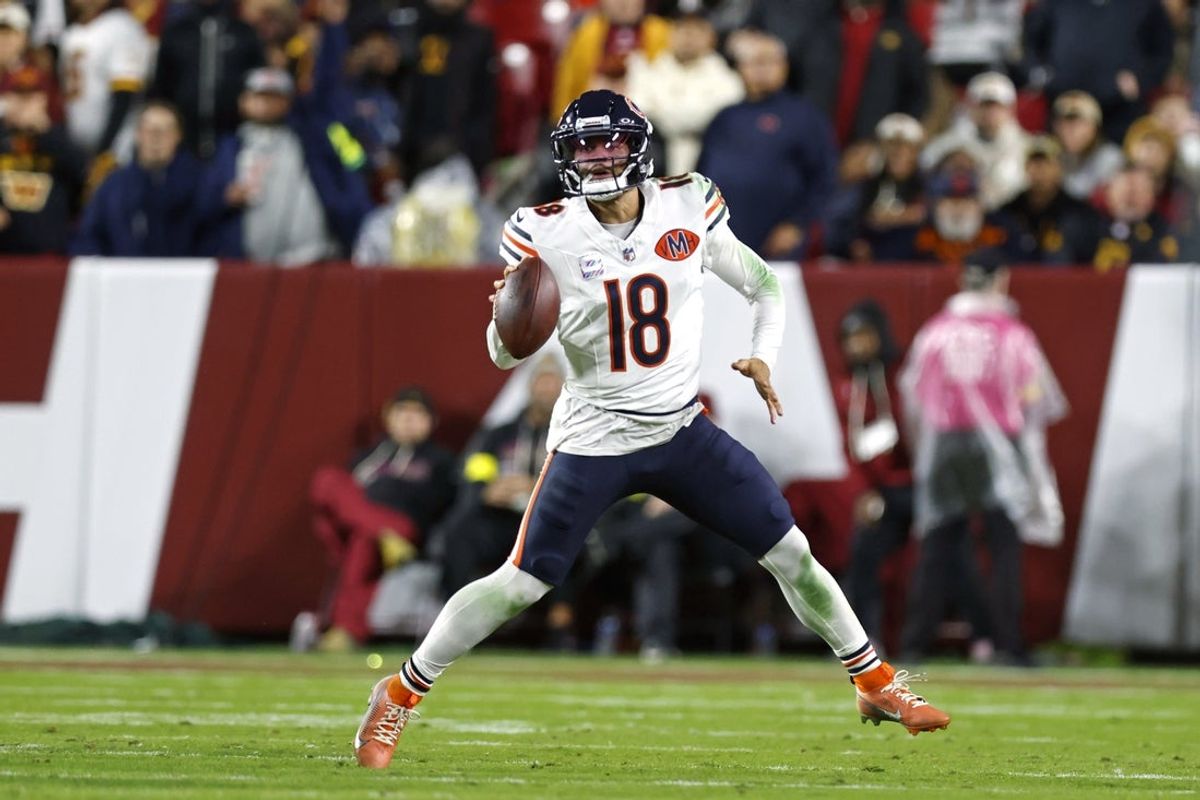 Oct 13, 2025; Landover, Maryland, USA; Chicago Bears quarterback Caleb Williams (18) looks to pass the ball against the Washington Commanders during the second quarter at Northwest Stadium. Mandatory Credit: Peter Casey-Imagn Images