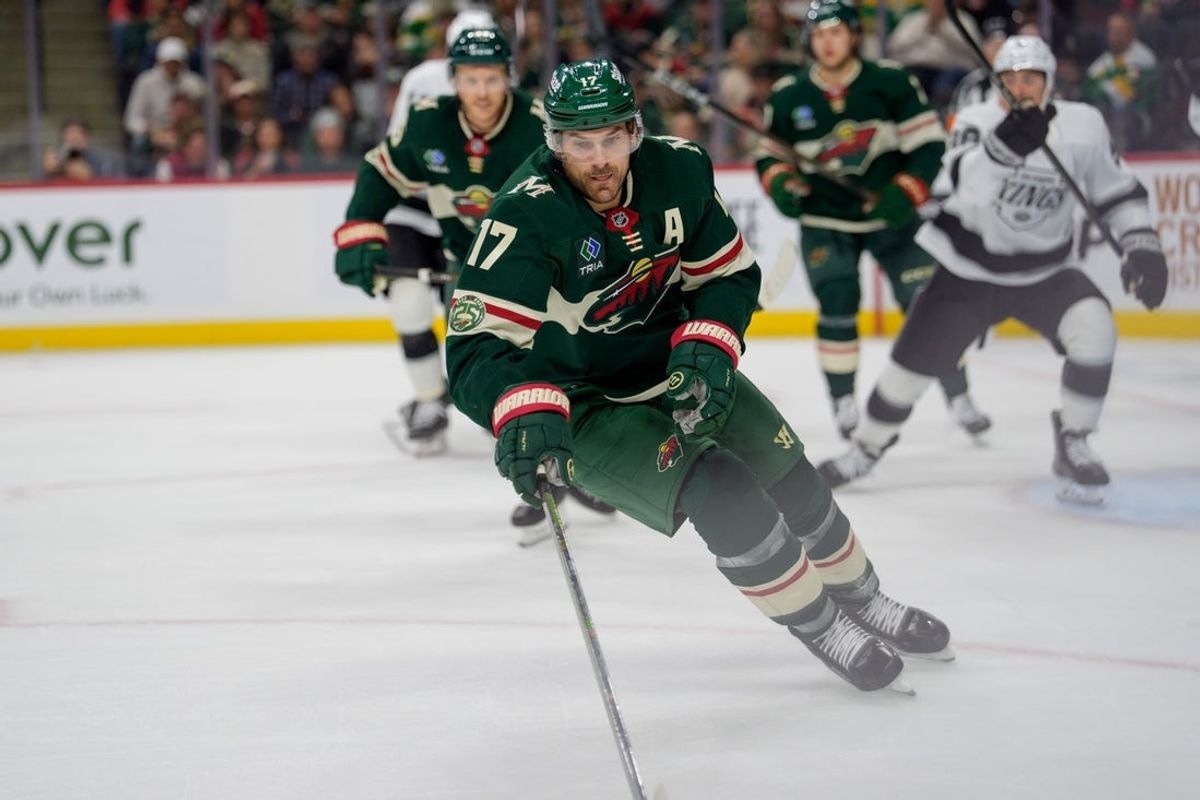 Oct 13, 2025; Saint Paul, Minnesota, USA; Minnesota Wild left wing Marcus Foligno (17) plays a puck against the Los Angeles Kings in the second period at Grand Casino Arena. Mandatory Credit: Matt Blewett-Imagn Images