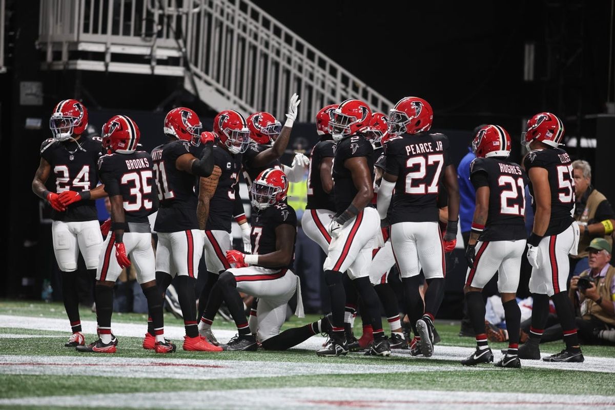 Oct 13, 2025; Atlanta, Georgia, USA; The Atlanta Falcons defense celebrates an interception in the end zone during the second half of a game against the Buffalo Bills at Mercedes-Benz Stadium. Mandatory Credit: Brett Davis-Imagn Images