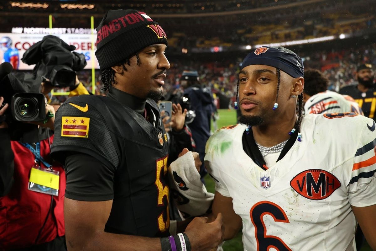 Oct 13, 2025; Landover, Maryland, USA; Washington Commanders quarterback Jayden Daniels (5) greets Chicago Bears cornerback Kyler Gordon (6) after the game at Northwest Stadium. Mandatory Credit: Geoff Burke-Imagn Images