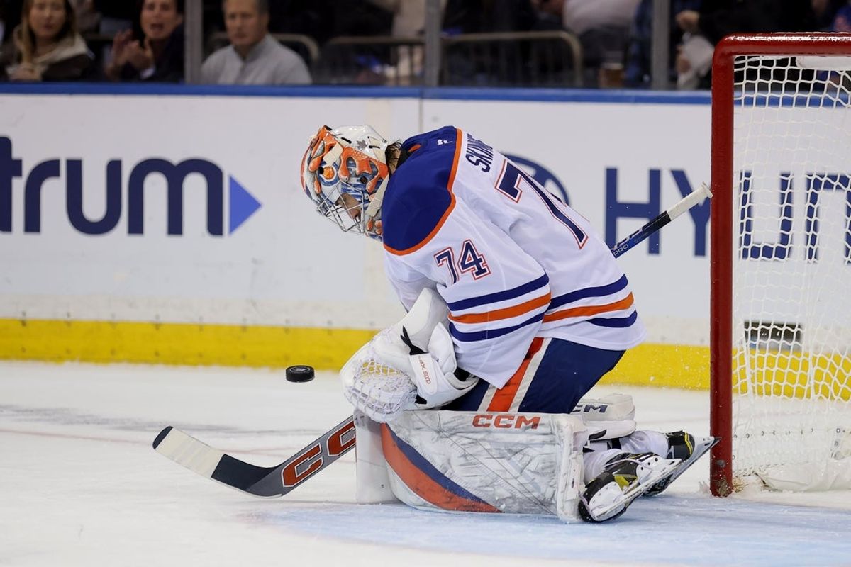 Oct 14, 2025; New York, New York, USA; Edmonton Oilers goaltender Stuart Skinner (74) makes a save against the New York Rangers during the first period at Madison Square Garden. Mandatory Credit: Brad Penner-Imagn Images