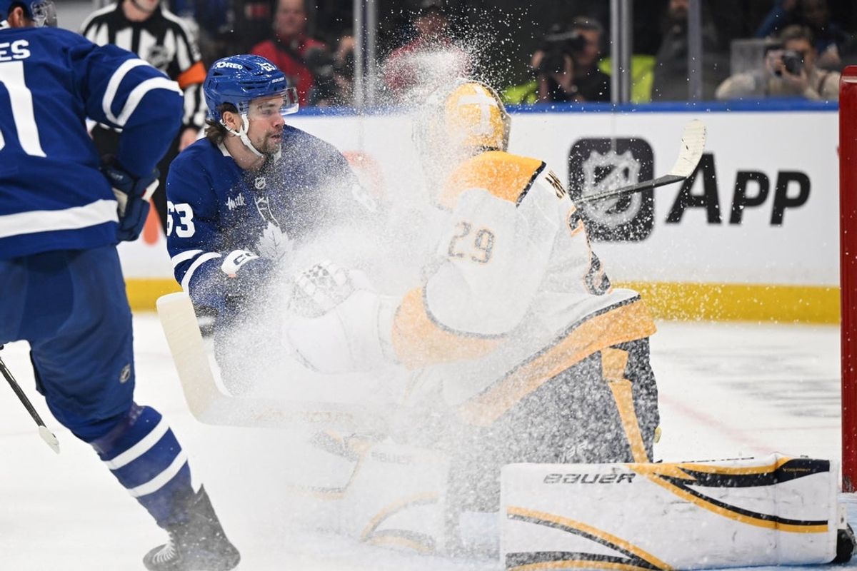 Oct 14, 2025; Toronto, Ontario, CAN;   Toronto Maple Leafs forward Matias Maccelli (63) sprays ice on Nashville Predators goalie Justus Annunen (29) in the first period at Scotiabank Arena. Mandatory Credit: Dan Hamilton-Imagn Images
