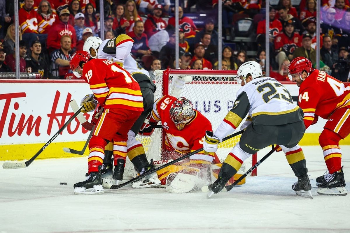 Oct 14, 2025; Calgary, Alberta, CAN; Calgary Flames goaltender Dustin Wolf (32) guards his net against the Vegas Golden Knights during the first period at Scotiabank Saddledome. Mandatory Credit: Sergei Belski-Imagn Images