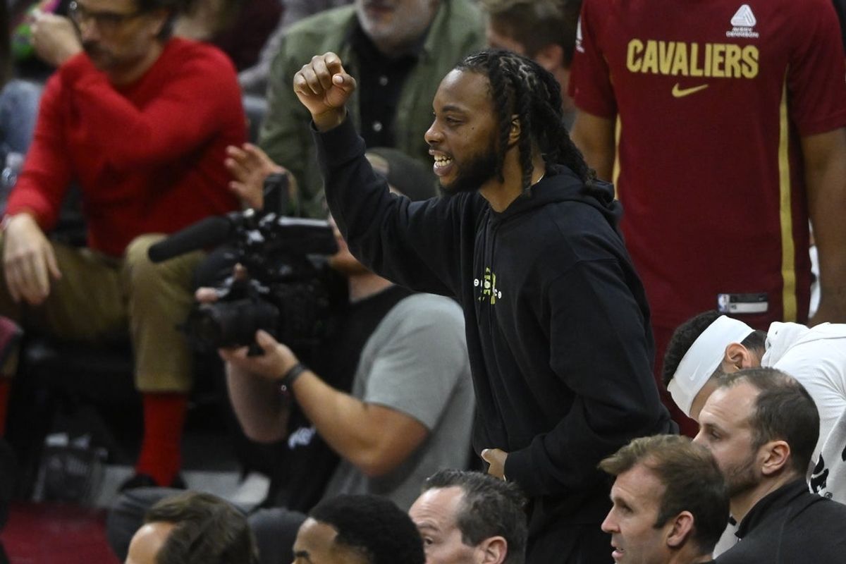 Oct 14, 2025; Cleveland, Ohio, USA; Cleveland Cavaliers guard Darius Garland (10) cheers from the bench in the fourth quarter against the Detroit Pistons at Rocket Arena. Mandatory Credit: David Richard-Imagn Images