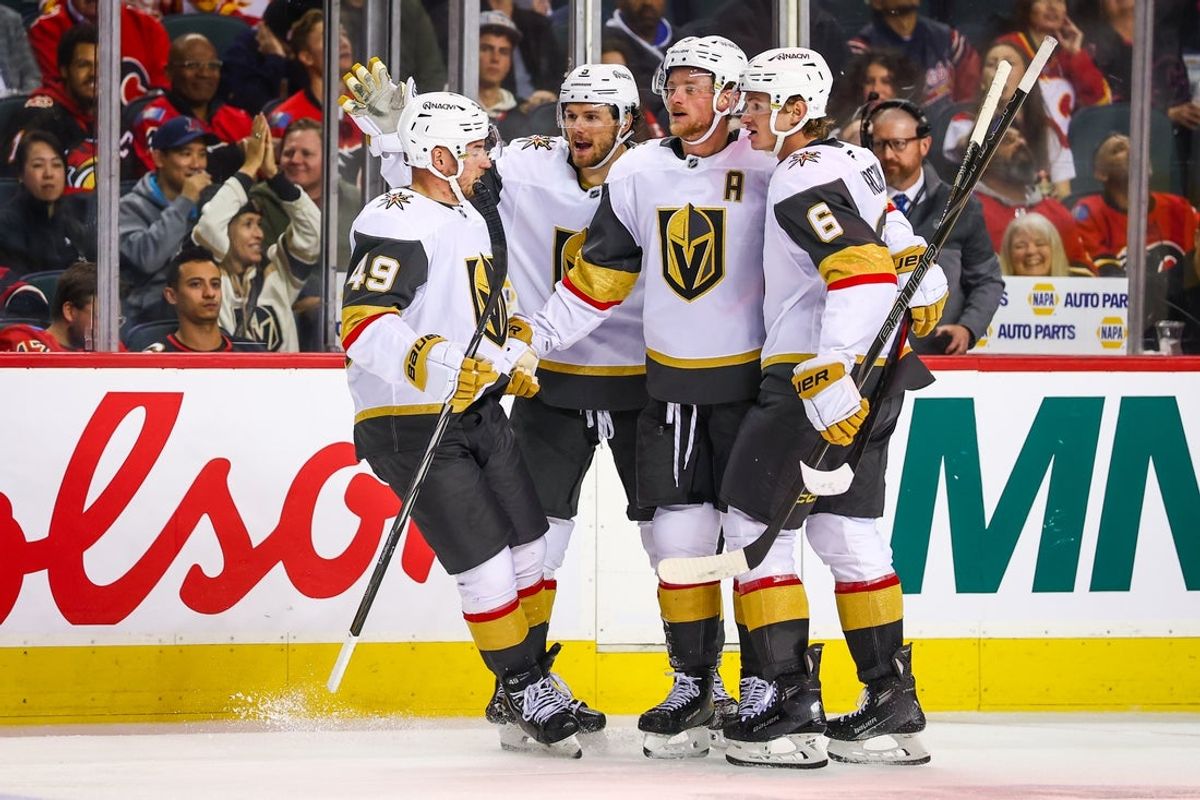 Oct 14, 2025; Calgary, Alberta, CAN; Vegas Golden Knights center Jack Eichel (9) celebrates his goal with teammates against the Calgary Flames during the third period at Scotiabank Saddledome. Mandatory Credit: Sergei Belski-Imagn Images