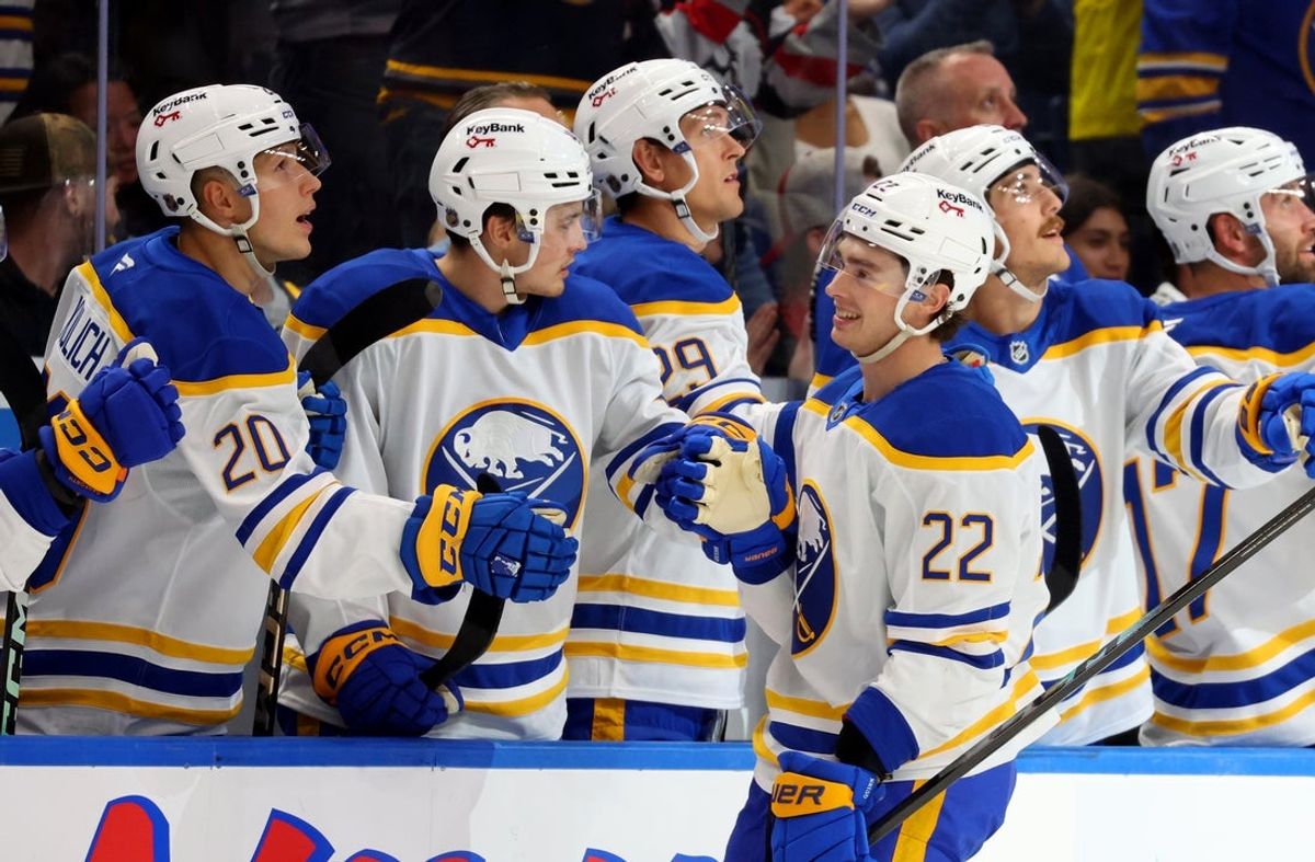 Oct 15, 2025; Buffalo, New York, USA;  Buffalo Sabres right wing Jack Quinn (22) celebrates his goal with teammates during the first period against the Ottawa Senators at KeyBank Center. Mandatory Credit: Timothy T. Ludwig-Imagn Images