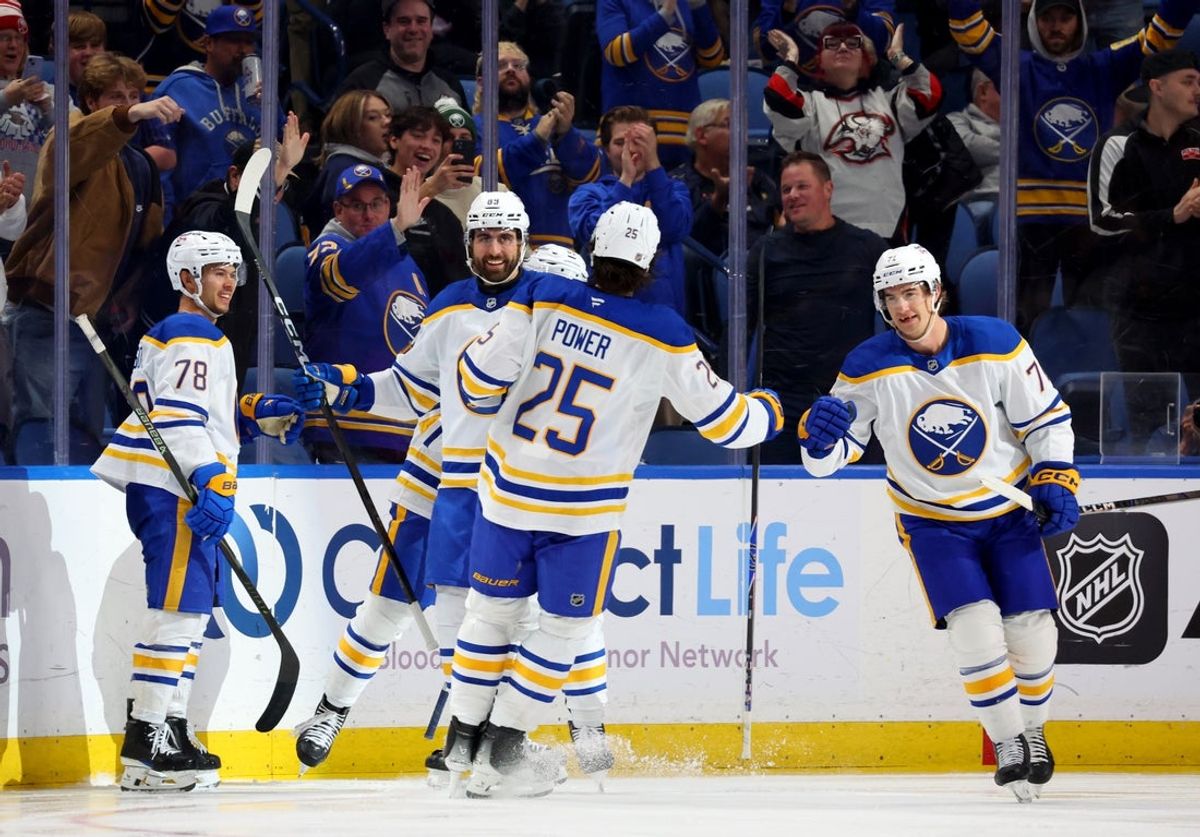 Oct 15, 2025; Buffalo, New York, USA;  Buffalo Sabres center Ryan McLeod (71) celebrates his second goal of the game with teammates during the third period against the Ottawa Senators at KeyBank Center. Mandatory Credit: Timothy T. Ludwig-Imagn Images