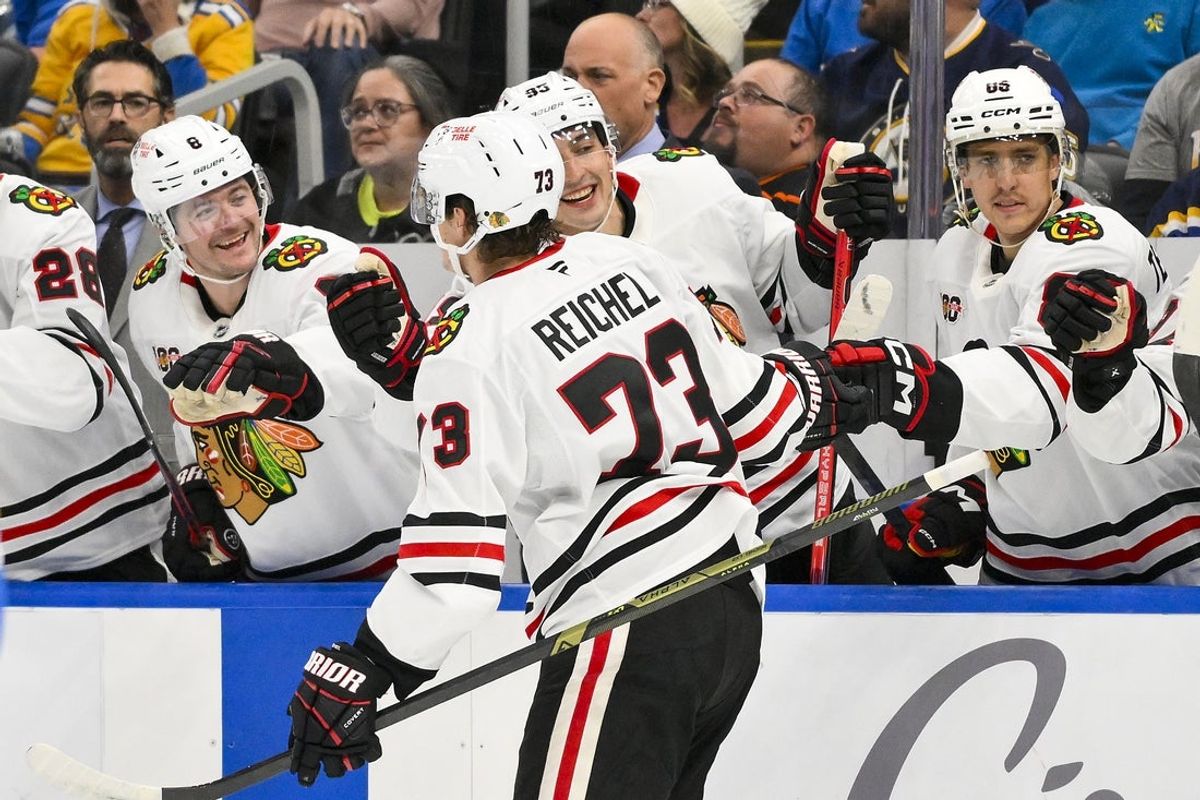 Oct 15, 2025; St. Louis, Missouri, USA; Chicago Blackhawks left wing Lukas Reichel (73) is congratulated by teammates after scoring against the St. Louis Blues during the second period at Enterprise Center. Mandatory Credit: Jeff Curry-Imagn Images