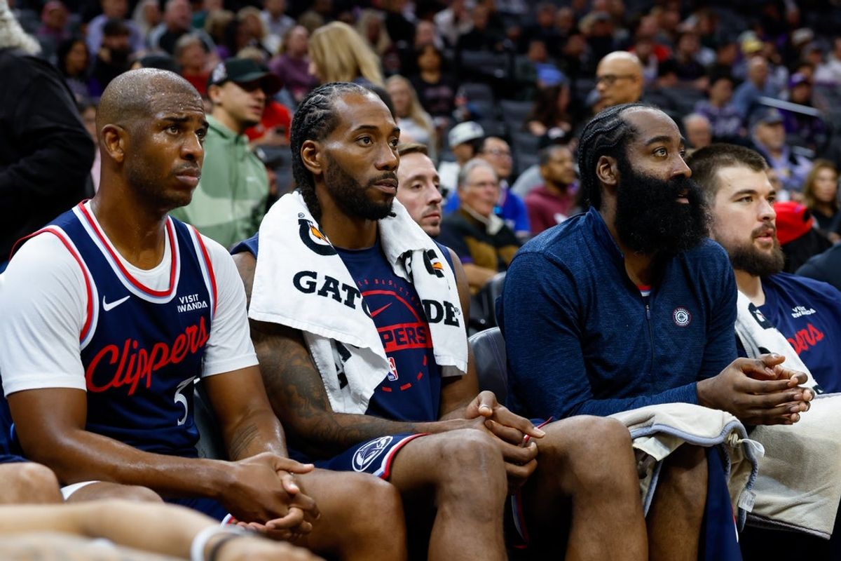 Oct 15, 2025; Sacramento, California, USA; Los Angeles Clippers guard Chris Paul (3) and forward Kawhi Leonard (2) and guard James Harden (1) sit on the bench during the fourth quarter against the Sacramento Kings at Golden 1 Center. Mandatory Credit: Sergio Estrada-Imagn Images