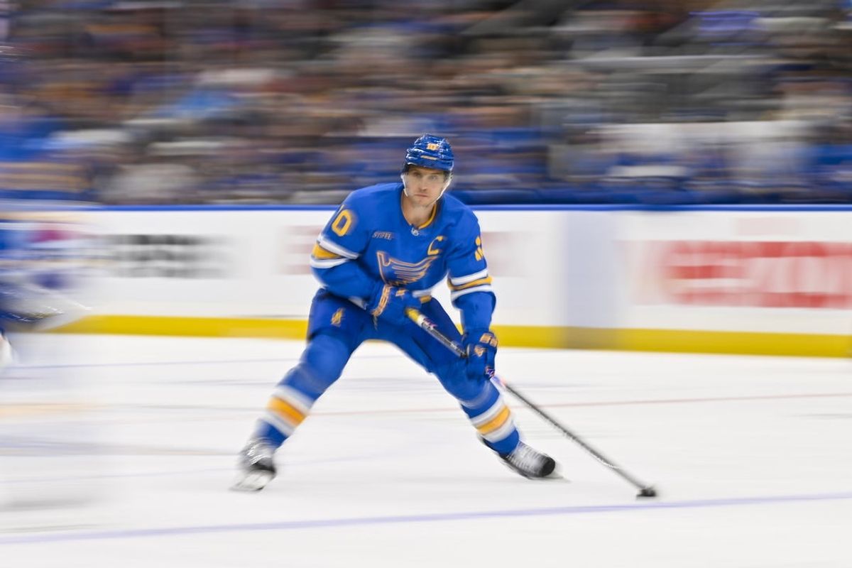 Oct 15, 2025; St. Louis, Missouri, USA; St. Louis Blues center Brayden Schenn (10) controls the puck against the Chicago Blackhawks during the third period at Enterprise Center. Mandatory Credit: Jeff Curry-Imagn Images
