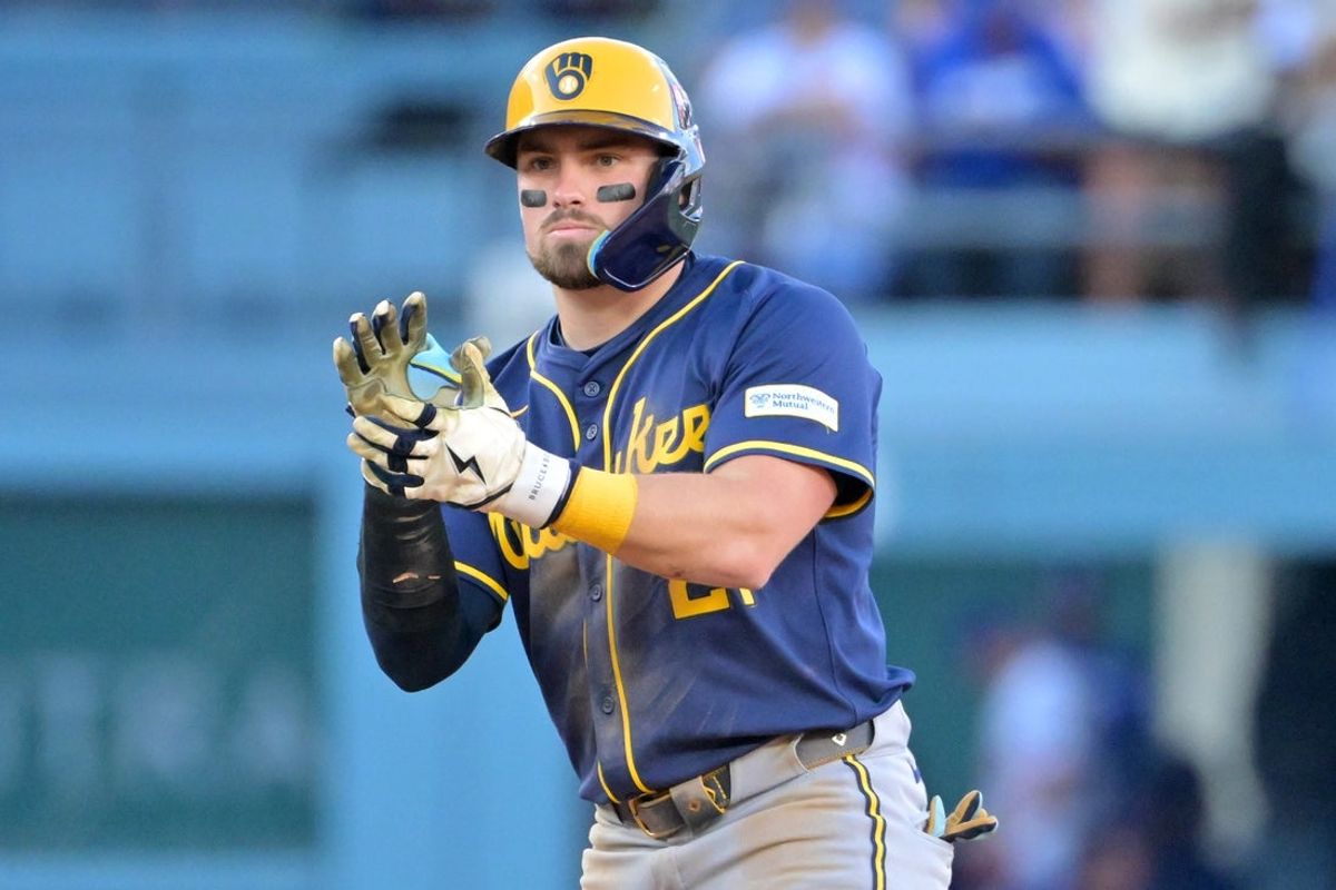Oct 16, 2025; Los Angeles, California, USA; Milwaukee Brewers third baseman Caleb Durbin (21) reacts at second after hitting a double against the Los Angeles Dodgers in the seventh inning during game three of the NLCS round for the 2025 MLB playoffs at Dodger Stadium. Mandatory Credit: Jayne Kamin-Oncea-Imagn Images