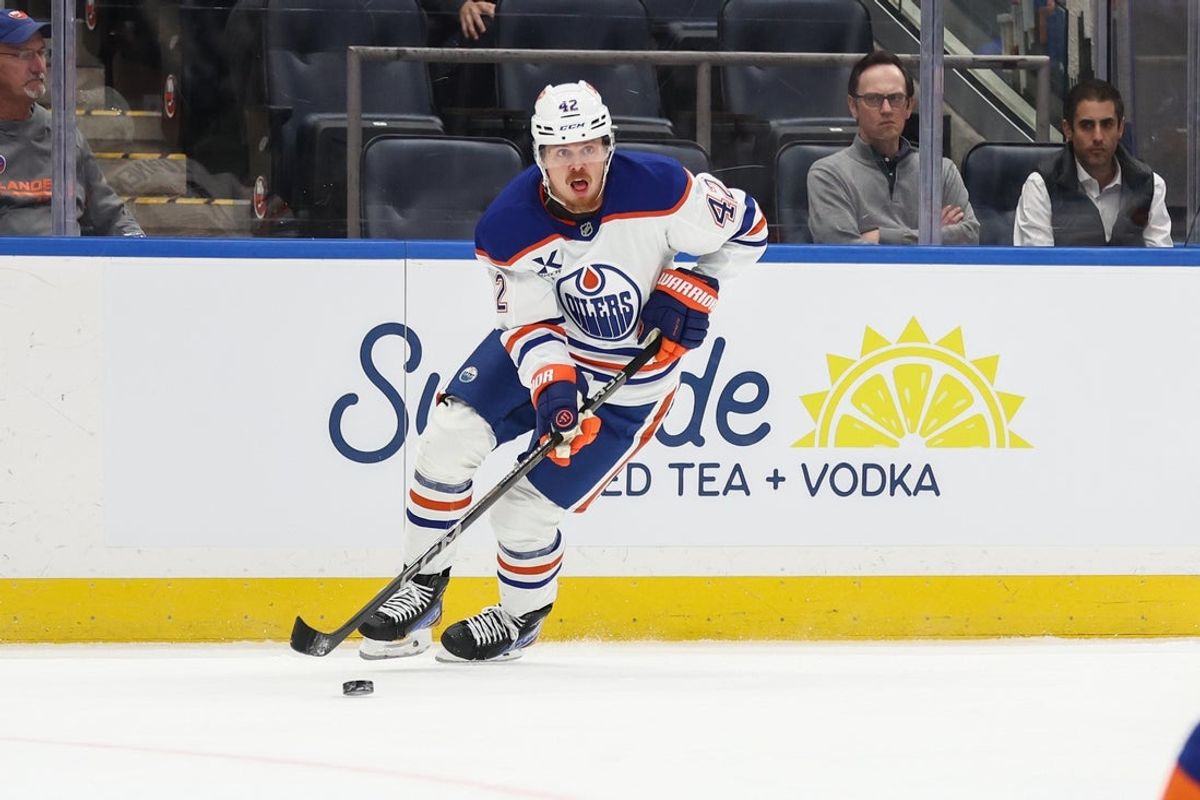 Oct 16, 2025; Elmont, New York, USA; Edmonton Oilers right wing Kasperi Kapanen (42) looks to make a pass in the first period against the New York Islanders at UBS Arena. Mandatory Credit: Wendell Cruz-Imagn Images