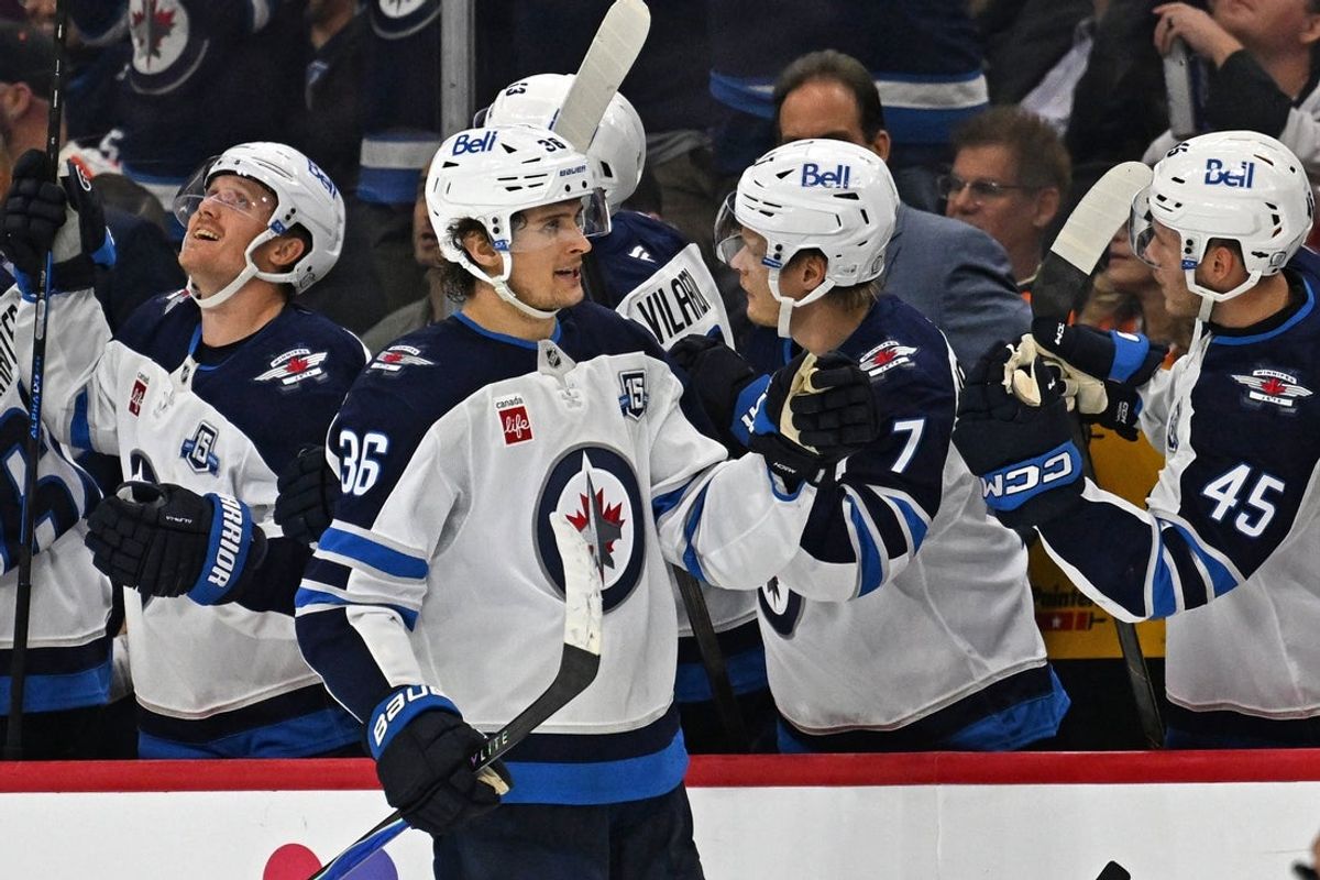 Oct 16, 2025; Philadelphia, Pennsylvania, USA; Winnipeg Jets center Morgan Barron (36) celebrates his goal with teammates against the Philadelphia Flyers during the second period at Wells Fargo Center. Mandatory Credit: Eric Hartline-Imagn Images