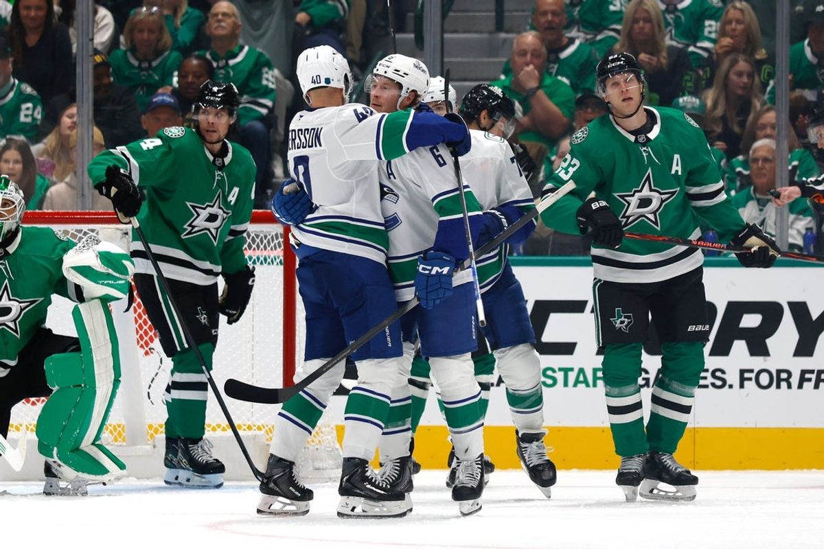 Oct 16, 2025; Dallas, Texas, USA; Vancouver Canucks right wing Brock Boeser (6) celebrates with teammates after scoring a goal against the Dallas Stars during the second period at American Airlines Center. Mandatory Credit: Chris Jones-Imagn Images