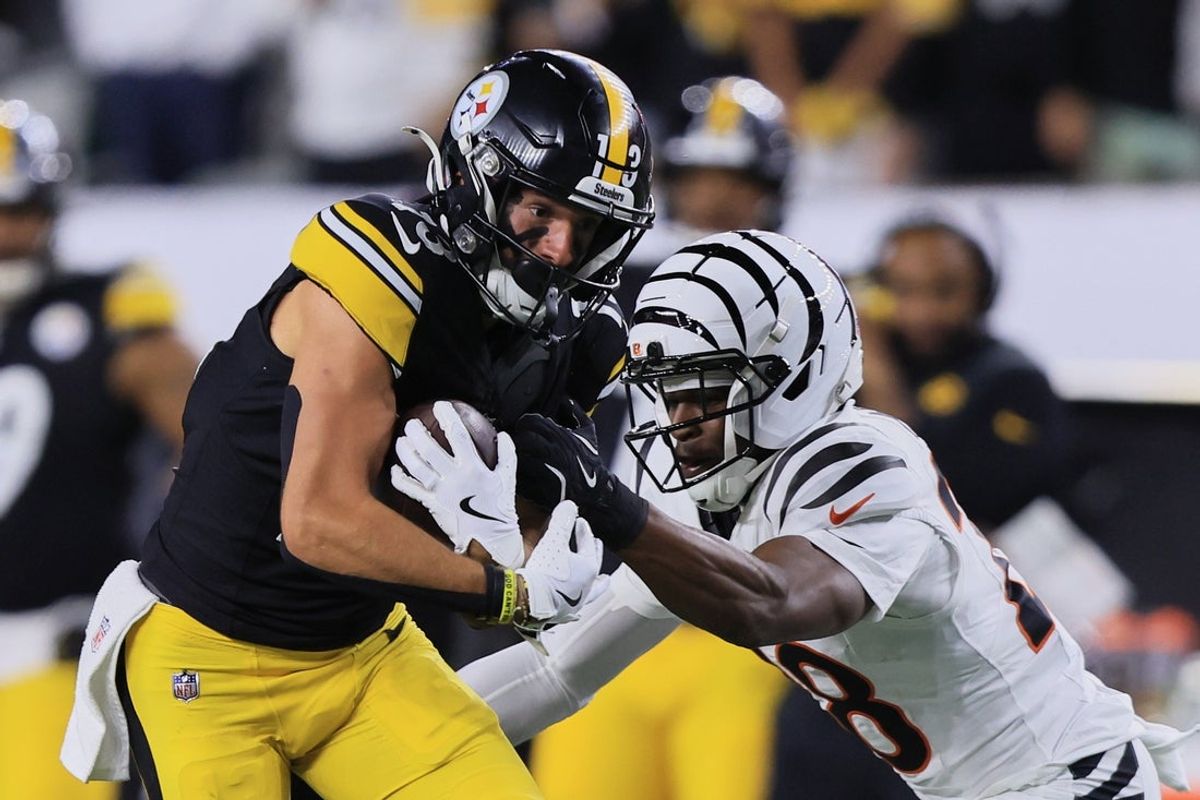 Oct 16, 2025; Cincinnati, Ohio, USA; Pittsburgh Steelers wide receiver Scotty Miller (13) runs with the ball against Cincinnati Bengals cornerback Josh Newton (28) during the second quarter at Paycor Stadium. Mandatory Credit: Katie Stratman-Imagn Images