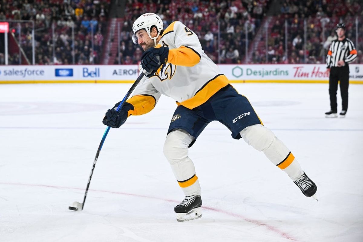 Oct 16, 2025; Montreal, Quebec, CAN; Nashville Predators left wing Filip Forsberg (9) shoots the puck against the Montreal Canadiens during the third period at Bell Centre. Mandatory Credit: David Kirouac-Imagn Images