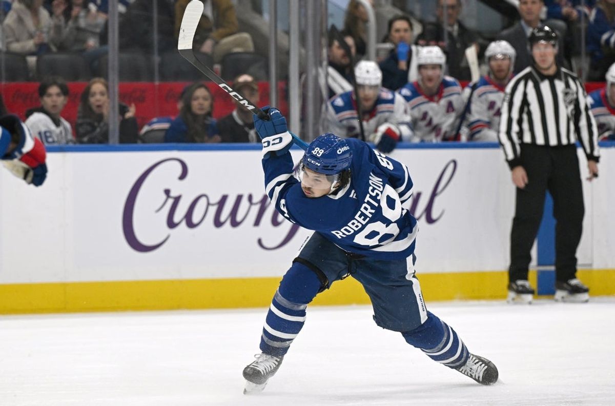 Oct 16, 2025; Toronto, Ontario, CAN; Toronto Maple Leafs forward Nick Robertson (89) follows through on a slapshot against the New York Rangers in the third period at Scotiabank Arena. Mandatory Credit: Dan Hamilton-Imagn Images