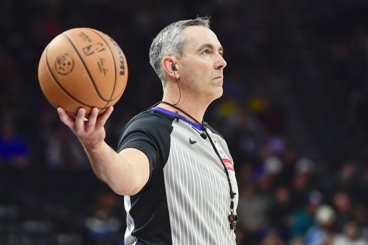 Oct 16, 2025; Salt Lake City, Utah, USA; Referee Brett Nansel (44) holds the ball for the Portland Trail Blazers to throw in against the Utah Jazz at Delta Center. Mandatory Credit: Peter Creveling-Imagn Images