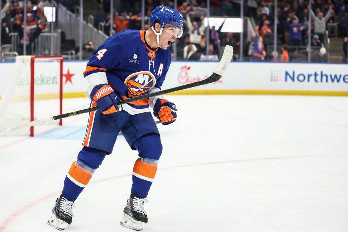 Oct 16, 2025; Elmont, New York, USA; New York Islanders center Bo Horvat (14) celebrates after scoring a goal in the second period against the Edmonton Oilers at UBS Arena. Mandatory Credit: Wendell Cruz-Imagn Images