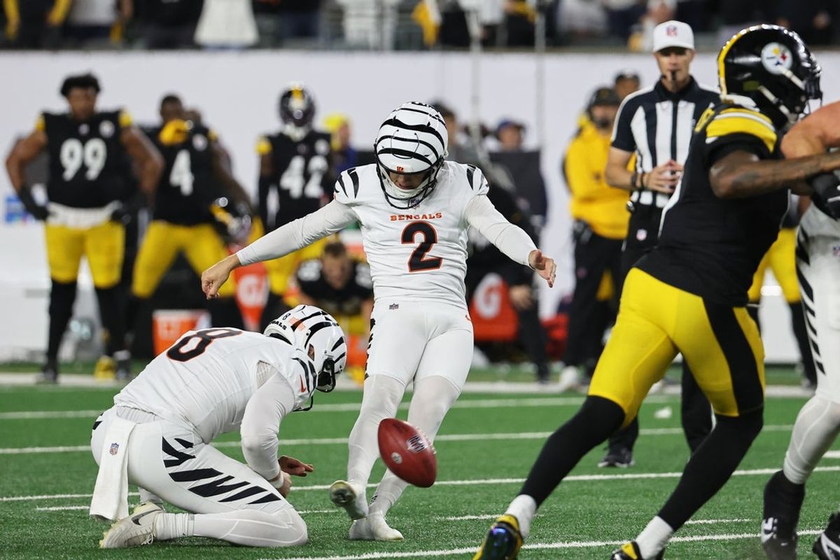 Oct 16, 2025; Cincinnati, Ohio, USA; Cincinnati Bengals placekicker Evan McPherson (2) kicks the game-winning field goal against the Pittsburgh Steelers held by punter Ryan Rehkow (8) during the fourth quarter at Paycor Stadium. Mandatory Credit: Joseph Maiorana-Imagn Images