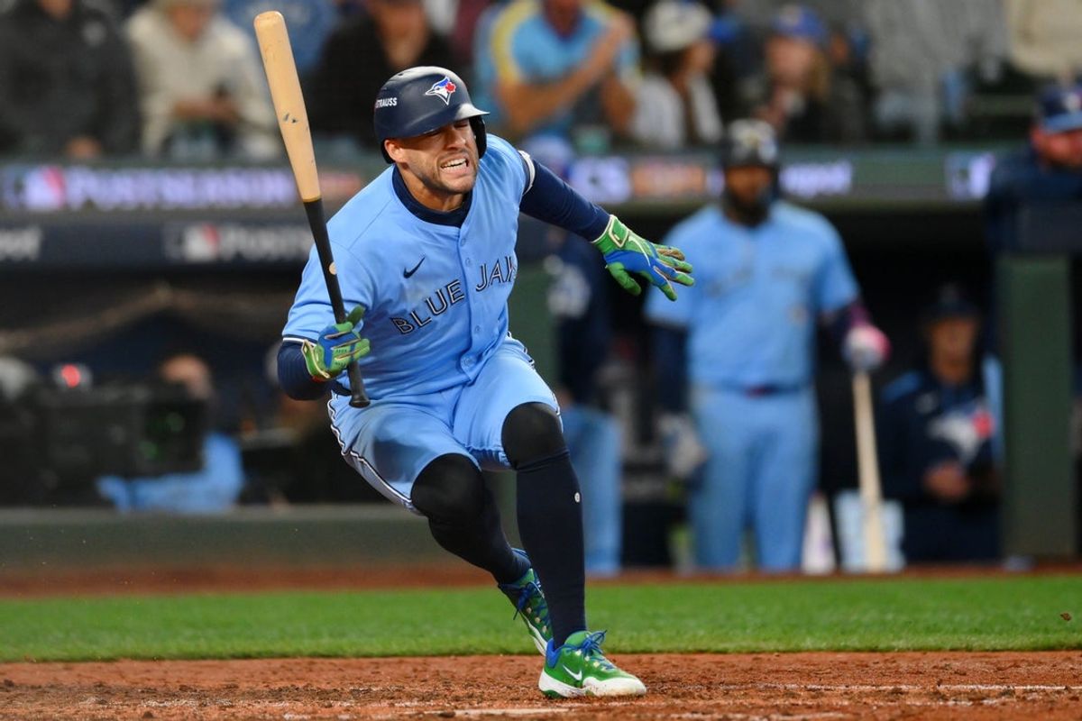 Oct 17, 2025; Seattle, Washington, USA; Toronto Blue Jays designated hitter George Springer (4) reacts after getting hit by a pitch against the Seattle Mariners during the seventh inning during game five of the ALCS round for the 2025 MLB playoffs at T-Mobile Park. Mandatory Credit: Steven Bisig-Imagn Images