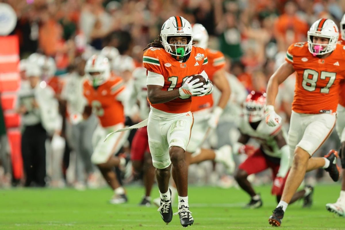 Oct 17, 2025; Miami Gardens, Florida, USA; Miami Hurricanes wide receiver Malachi Toney (10) carries the football against the Louisville Cardinals during the second quarter at Hard Rock Stadium. Mandatory Credit: Sam Navarro-Imagn Images