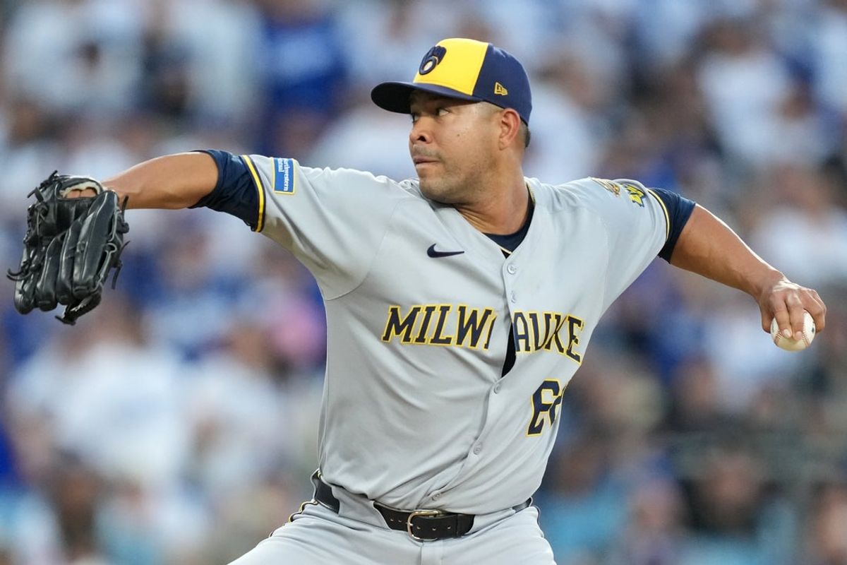 Oct 17, 2025; Los Angeles, California, USA; Milwaukee Brewers pitcher Jose Quintana (62) pitches against the Los Angeles Dodgers in the first inning during game four of the NLCS round for the 2025 MLB playoffs at Dodger Stadium. Mandatory Credit: Kirby Lee-Imagn Images