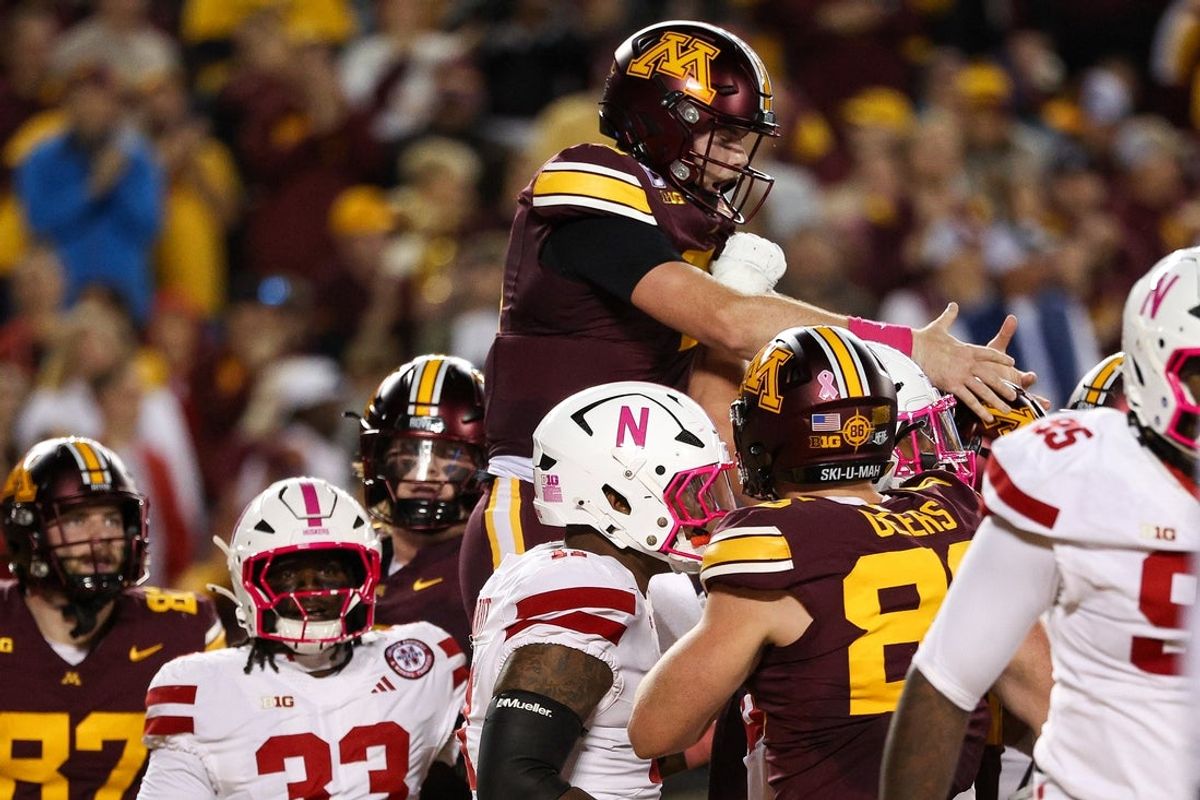 Oct 17, 2025; Minneapolis, Minnesota, USA; Minnesota Golden Gophers quarterback Drake Lindsey (5) celebrates his touchdown against the Nebraska Cornhuskers during the first half at Huntington Bank Stadium. Mandatory Credit: Matt Krohn-Imagn Images