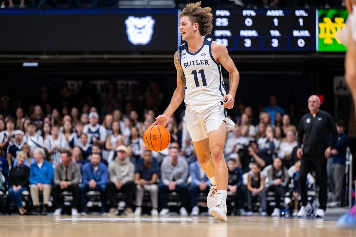 Butler Bulldogs guard Finley Bizjack (11) brings the ball up court during the first half of an NCAA basketball game against the Notre Dame Fighting Irish, Friday, Oct. 17, 2025, at Hinkle Fieldhouse.