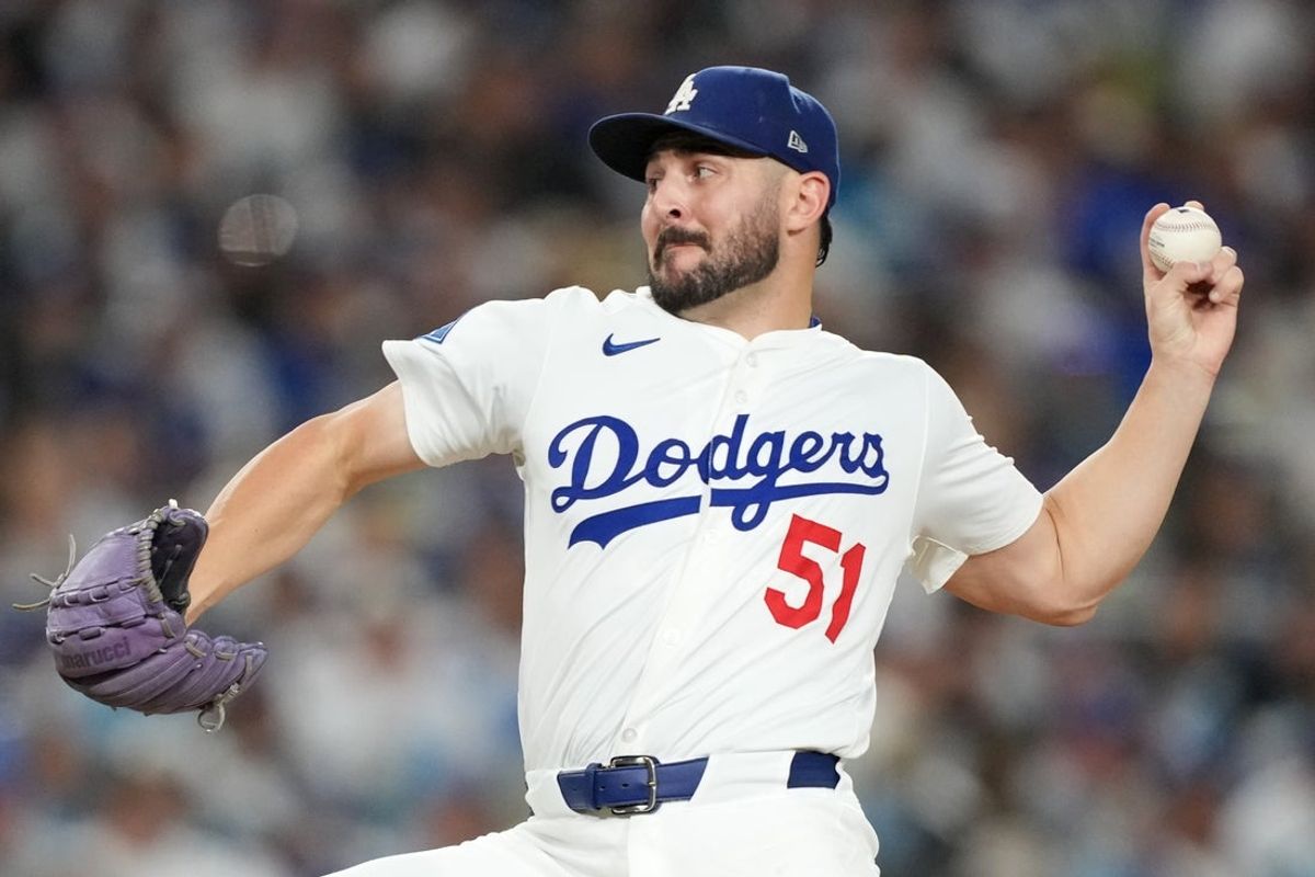 Oct 17, 2025; Los Angeles, California, USA; Los Angeles Dodgers pitcher Alex Vesia (51) pitches against the Milwaukee Brewers in the seventh inning during game four of the NLCS round for the 2025 MLB playoffs at Dodger Stadium. Mandatory Credit: Kirby Lee-Imagn Images