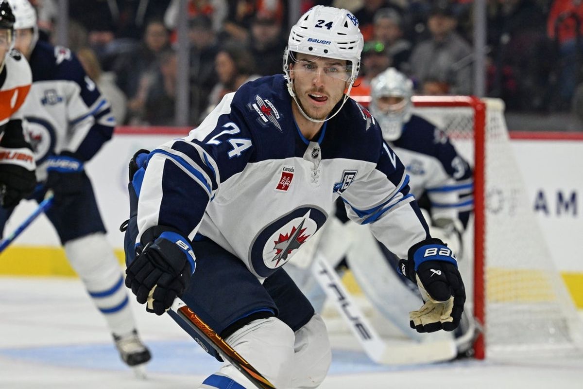 Oct 16, 2025; Philadelphia, Pennsylvania, USA; Winnipeg Jets defenseman Haydn Fleury (24) defends against the Philadelphia Flyers at Wells Fargo Center. Mandatory Credit: Eric Hartline-Imagn Images