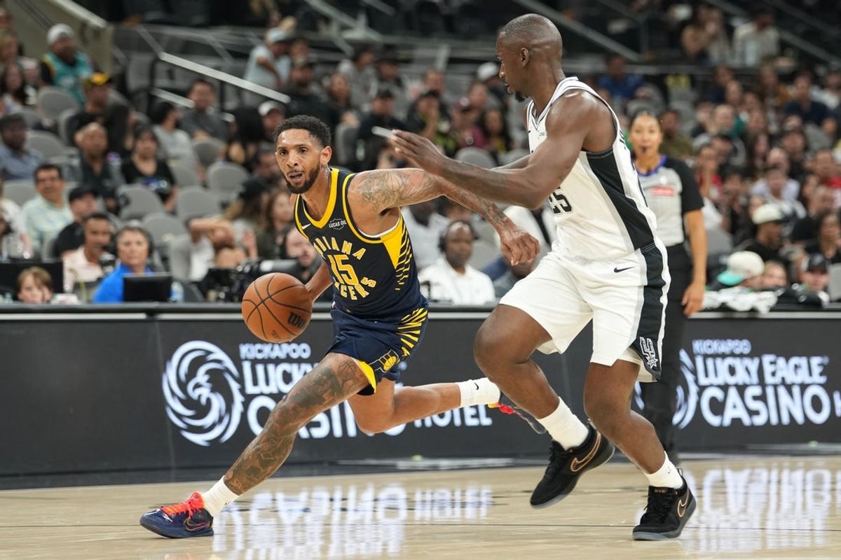 Oct 17, 2025; San Antonio, Texas, USA; Indiana Pacers guard Cameron Payne (15) drives to the basket against San Antonio Spurs forward David Jones Garcia (25) during the second half at Frost Bank Center. Mandatory Credit: Scott Wachter-Imagn Images