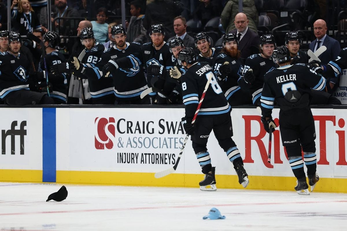 Oct 17, 2025; Salt Lake City, Utah, USA; Utah Mammoth center Nick Schmaltz (8) scores a third goal against the San Jose Sharks as fans throw their hats onto the ice to celebrate during the third period at Delta Center. Mandatory Credit: Rob Gray-Imagn Images