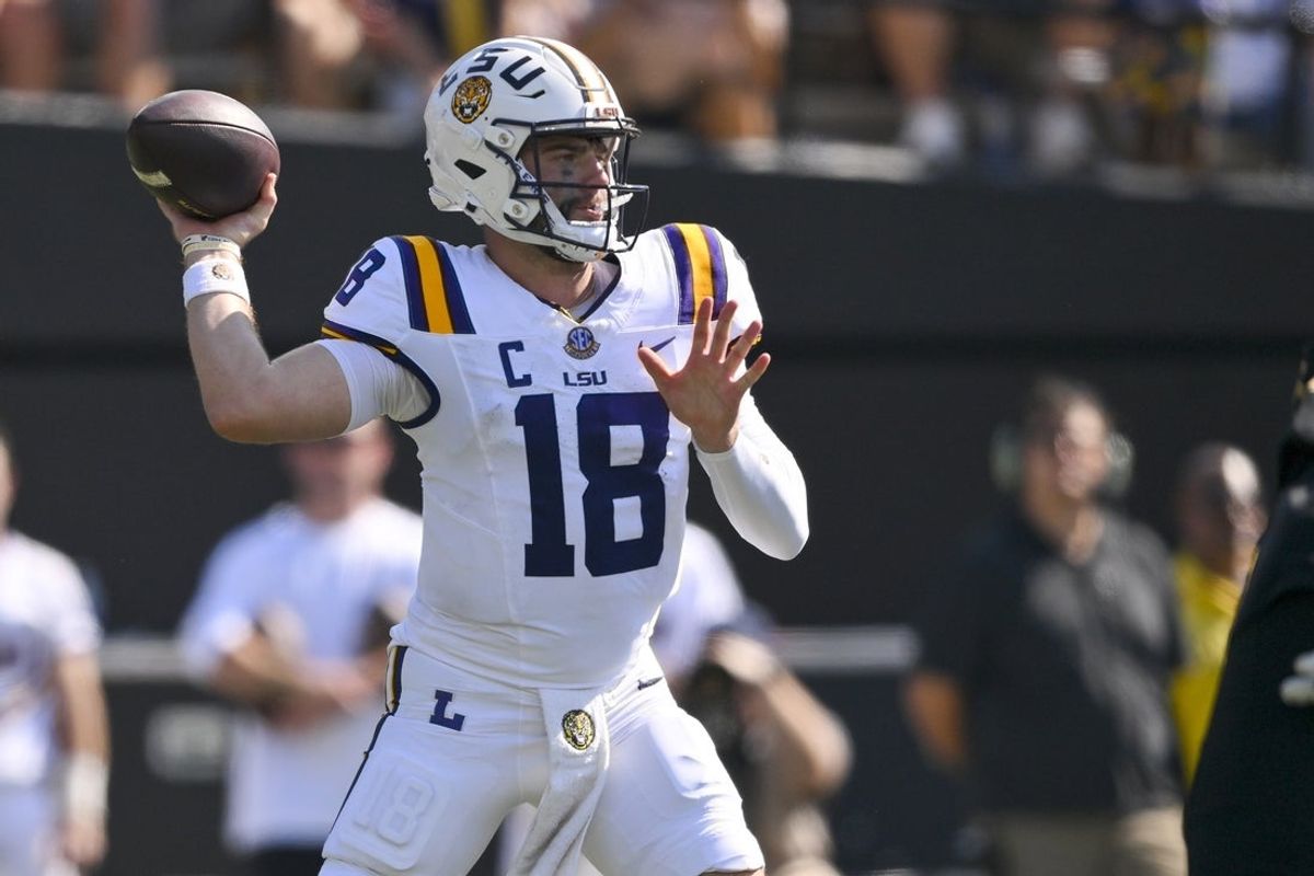 Oct 18, 2025; Nashville, Tennessee, USA;  Louisiana State Tigers quarterback Garrett Nussmeier (18) stands in the pocket against the Vanderbilt Commodores during the first half at FirstBank Stadium. Mandatory Credit: Steve Roberts-Imagn Images