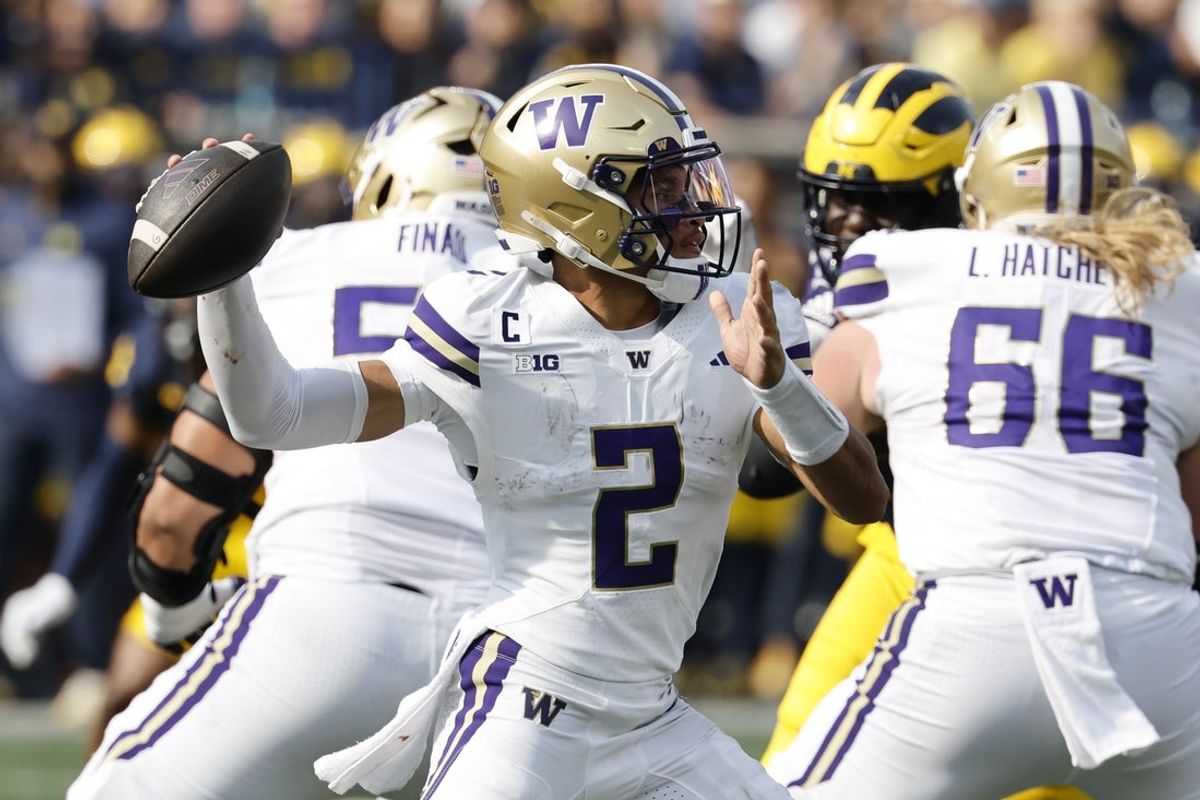 Oct 18, 2025; Ann Arbor, Michigan, USA;  Washington Huskies quarterback Demond Williams Jr. (2) passes in the second half against the Michigan Wolverines at Michigan Stadium. Mandatory Credit: Rick Osentoski-Imagn Images