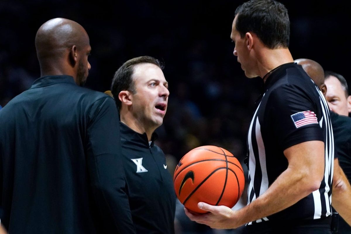 Xavier Musketeers head coach Richard Pitino speaks with a referee in the second half of a NCAA men’s basketball game between the Xavier Musketeers and Murray State Racers, Saturday, Oct. 18, 2025, at Cintas Center in Cincinnati.