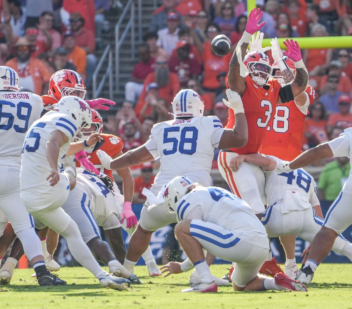 Oct 18, 2025; Clemson, South Carolina, USA; Southern Methodist Mustangs kicker Sam Keltner (95) makes a field goal as Clemson Tigers defensive end T.J. Parker (3) and tight end Ian Schieffelin (18) try to block it during the second quarter at Memorial Stadium. Mandatory Credit: Ken Ruinard-GREENVILLE NEWS-USA TODAY Network via Imagn Images