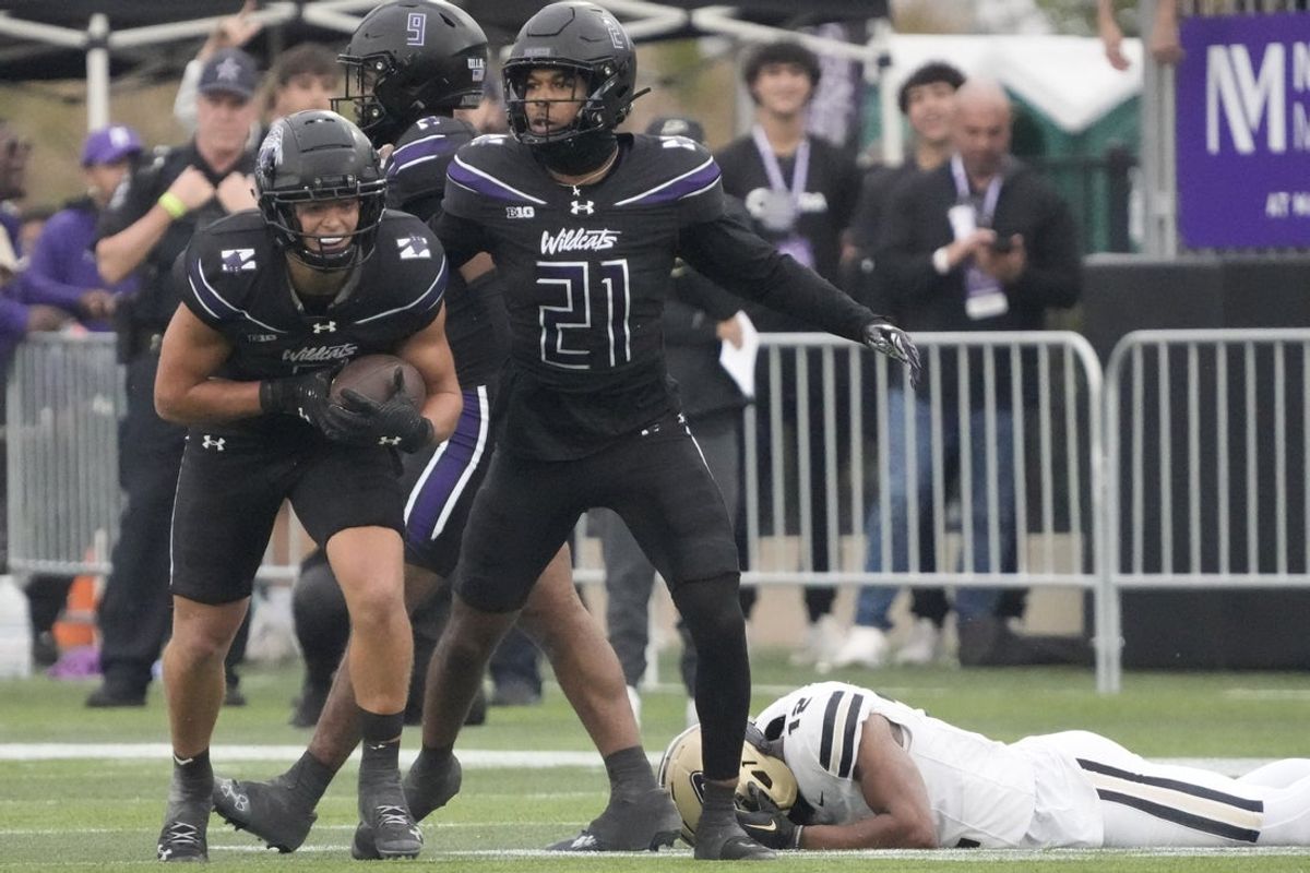 Oct 18, 2025; Evanston, Illinois, USA; Northwestern Wildcats defensive back Robert Fitzgerald (6) reacts after intercepting a pass against the Purdue Boilermakers during the second half at Northwestern Medicine Field at Martin Stadium. Mandatory Credit: David Banks-Imagn Images