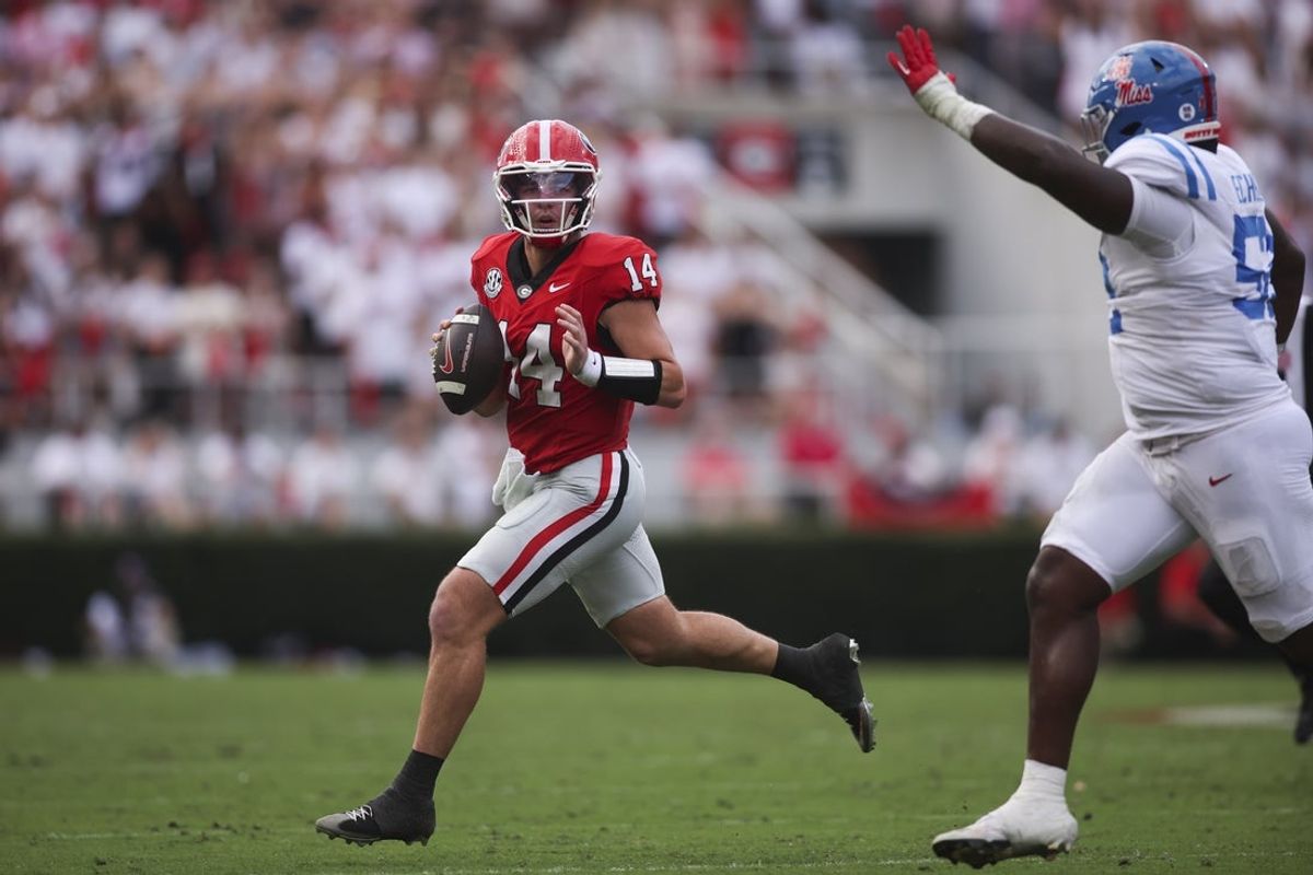 Oct 18, 2025; Athens, Georgia, USA;  Georgia Bulldogs quarterback Gunner Stockton (14) looks to pass against the Mississippi Rebels during the first half of the game at Sanford Stadium. Mandatory Credit: Brett Davis-Imagn Images