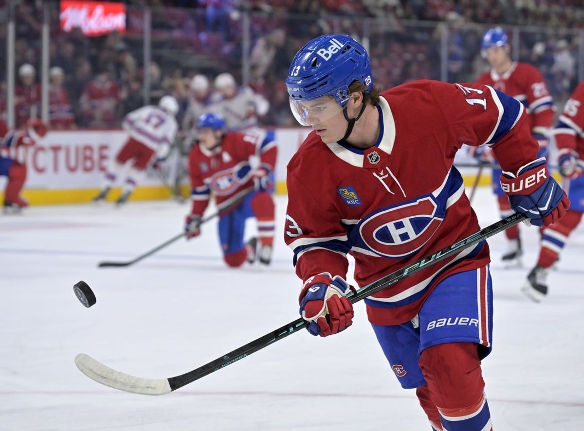 Oct 18, 2025; Montreal, Quebec, CAN; Montreal Canadiens forward Cole Caufield (13) juggles a puck during the warmup period before the game against the New York Rangers at the Bell Centre. Mandatory Credit: Eric Bolte-Imagn Images