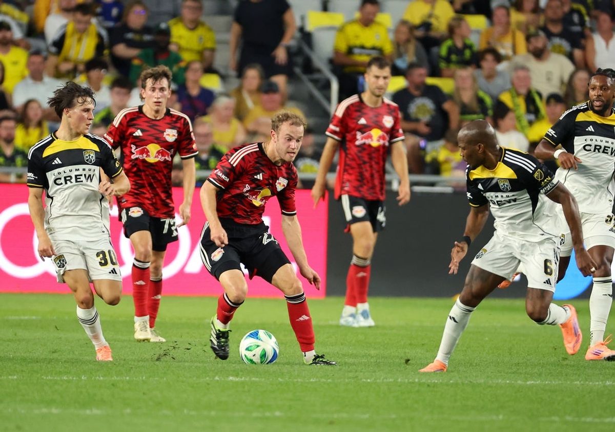 Oct 18, 2025; Columbus, Ohio, USA;  New York Red Bulls midfielder Dennis Gjengaar (22) controls the ball as Columbus Crew midfielder Hugo Picard (30) defends during the first half at Lower.com Field. Mandatory Credit: Joseph Maiorana-Imagn Images