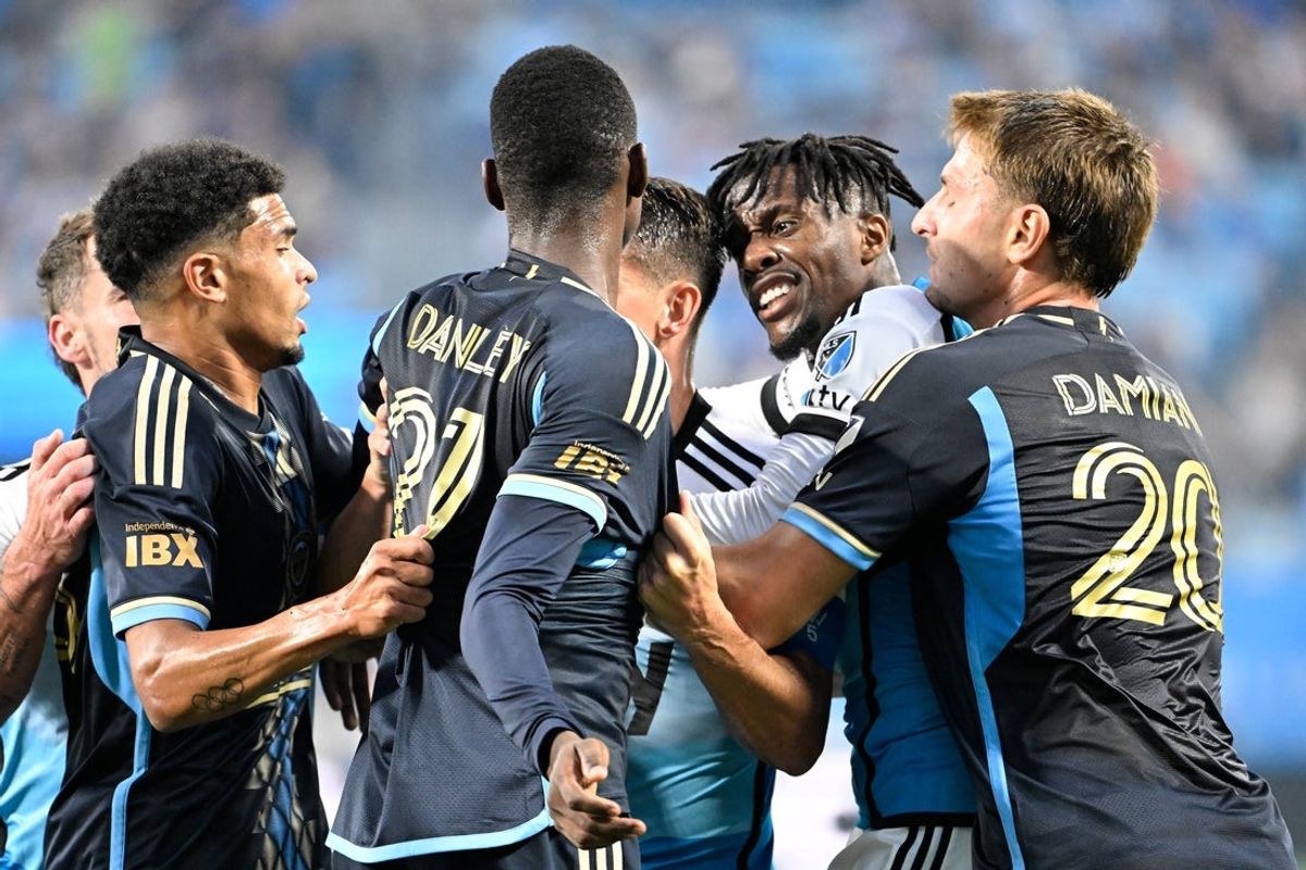Oct 18, 2025; Charlotte, North Carolina, USA; Charlotte FC forward Wilfried Zaha (10) and Philadelphia Union defender Nathan Harriel (26) and Philadelphia Union midfielder Danley Jean Jacques (21) and forward Bruno Damiani (20) argue in the first half at Bank of America Stadium. Mandatory Credit: Bob Donnan-Imagn Images