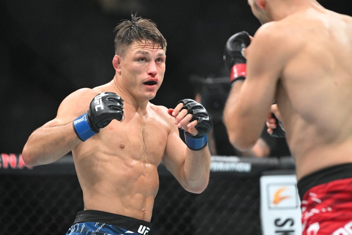 Oct 18, 2025; Vancouver, BC, CANADA; Kyle Prepolec (red gloves) fights Drew Dober (blue gloves) during UFC Fight Night at Rogers Arena. Mandatory Credit: Simon Fearn-Imagn Images