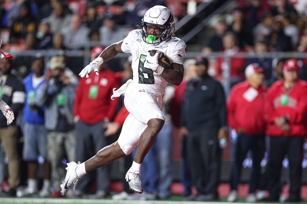Oct 18, 2025; Piscataway, New Jersey, USA;  Oregon Ducks running back Noah Whittington (6) scores a rushing touchdown during the first half against the Rutgers Scarlet Knights at SHI Stadium. Mandatory Credit: Vincent Carchietta-Imagn Images