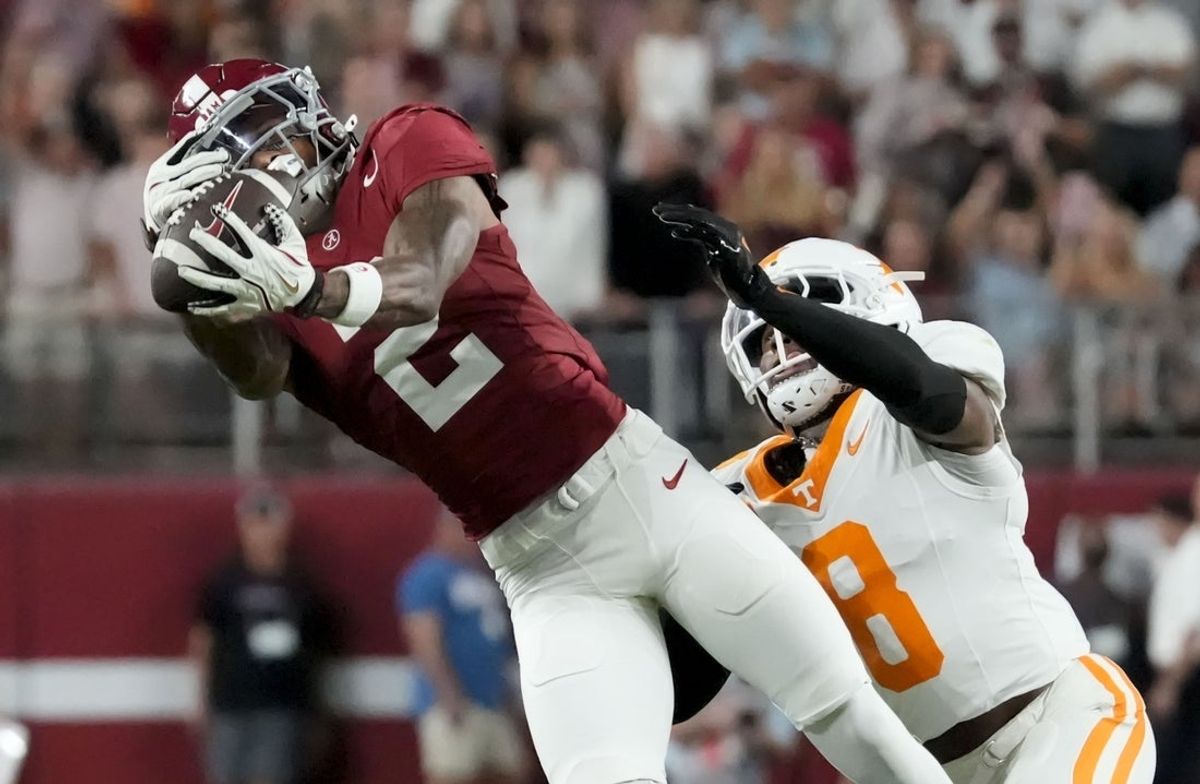 Oct 18, 2025; Tuscaloosa, Alabama, USA; Alabama Crimson Tide wide receiver Ryan Williams (2) makes a catch while being defended by Tennessee Volunteers defensive back Colton Hood (8) at Saban Field at Bryant-Denny Stadium. Mandatory Credit: Gary Cosby-USA TODAY Network via Imagn Images