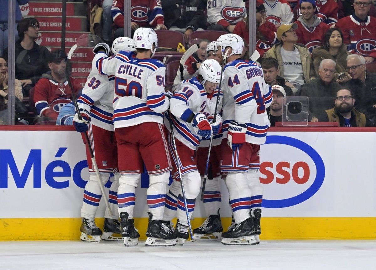 Oct 18, 2025; Montreal, Quebec, CAN; New York Rangers forward Artemi Panarin (10) celebrates with teammates after scoring a goal against the Montreal Canadiens during the third period at the Bell Centre. Mandatory Credit: Eric Bolte-Imagn Images