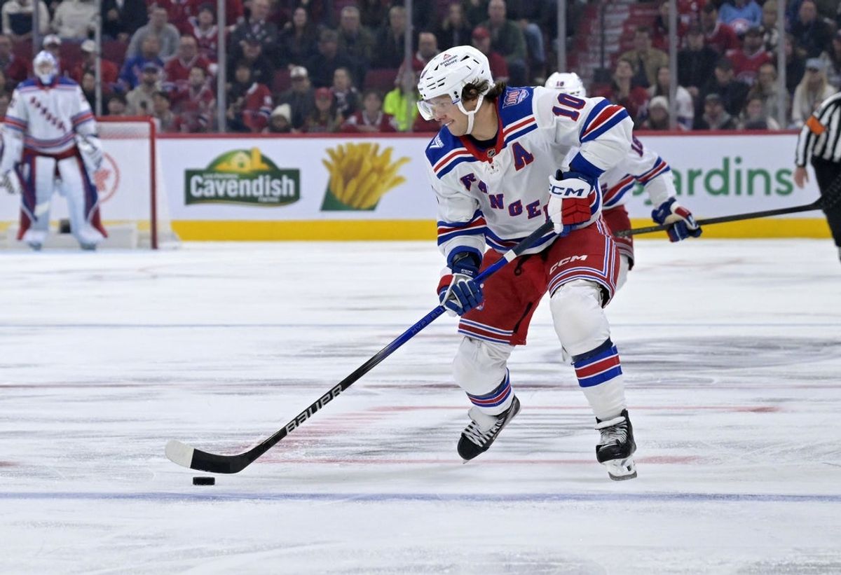 Oct 18, 2025; Montreal, Quebec, CAN; New York Rangers forward Artemi Panarin (10) plays the puck during the third period of the game against the Montreal Canadiens at the Bell Centre. Mandatory Credit: Eric Bolte-Imagn Images