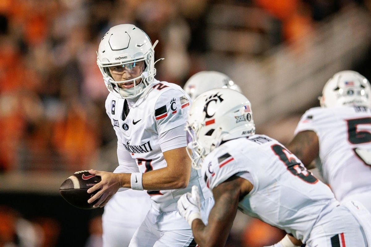 Oct 18, 2025; Stillwater, Oklahoma, USA; Cincinnati Bearcats quarterback Brendan Sorsby (2) looks to hand off during the first half against the Oklahoma State Cowboys at Boone Pickens Stadium. Mandatory Credit: William Purnell-Imagn Images