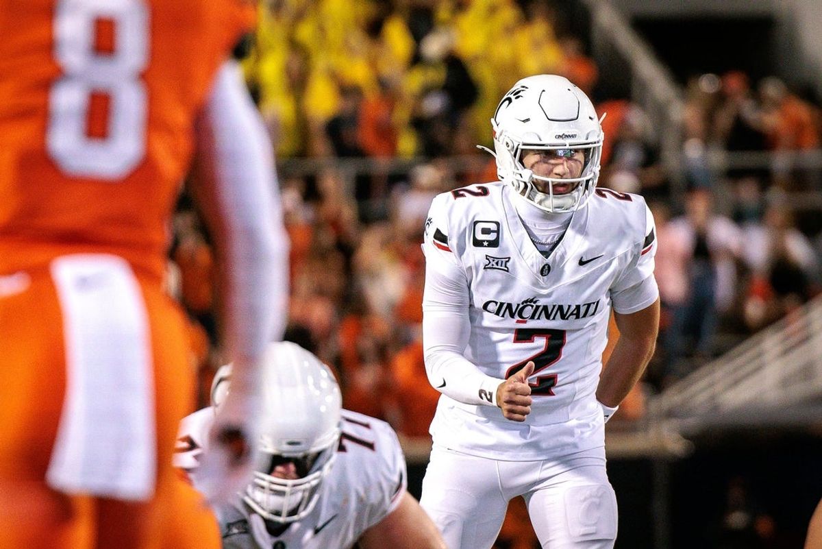 Oct 18, 2025; Stillwater, Oklahoma, USA; Cincinnati Bearcats quarterback Brendan Sorsby (2) behind the line during the first half against the Oklahoma State Cowboys  at Boone Pickens Stadium. Mandatory Credit: William Purnell-Imagn Images