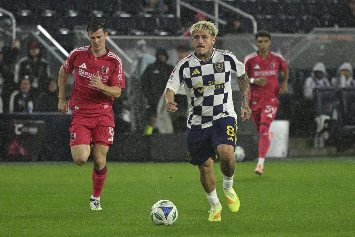 Oct 18, 2025; St. Louis, Missouri, USA; Real Salt Lake midfielder Diego Luna (8) controls the ball defended by in the first half at Energizer Park. Mandatory Credit: Joe Puetz-Imagn Images